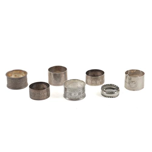SEVEN SILVER NAPKIN RINGS (7)