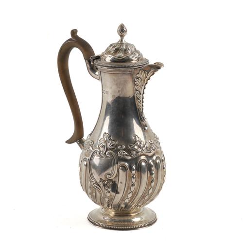 A LATE VICTORIAN SILVER HOT WATER JUG
