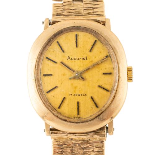 AN ACCURIST 9CT GOLD LADY'S WATCH