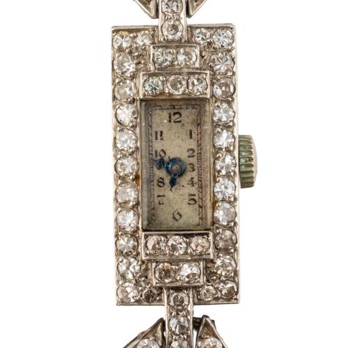 A PLATINUM AND DIAMOND COCKTAIL WATCH