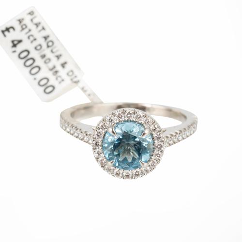 AN AQUAMARINE AND DIAMOND CLUSTER RING