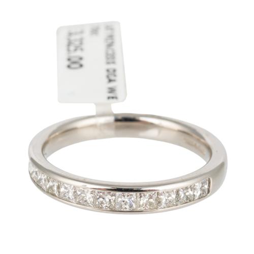 A PRINCESS CUT DIAMOND HALF ETERNITY RING