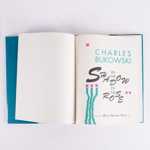 BUKOWSKI, Charles (1920-94). In the Shadow of the Rose, Santa Barbara, 1991, 4to, original coloured decorated boards, dust-jacket. FIRST EDITION. NUMBER 721 OF 750 COPIES NUMBERED AND SIGNED BY THE AUTHOR AND WITH A SELF-PORTRAIT SKETCH. Krumhansl 122a.