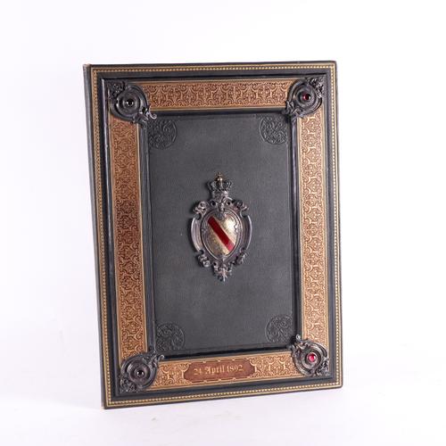 BINDING - A fine illuminated manuscript in German on two vellum leaves, with wide painted decorative borders, folio (420 x 310mm), VERY FINELY BOUND in contemporary highly elaborate panelled armorial morocco with garnets. Please see the full description.