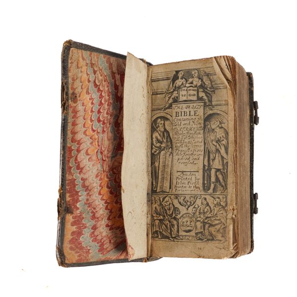 BIBLE, in English - The Holy Bible, London, "Printed by John Field, Printer to the Parliament", 1653, tall 24mo, engraved title, contemporary calf with a design of tendrils and flowerheads and initials "F. P." stamped on each cover (rubbed, lacks clasps).