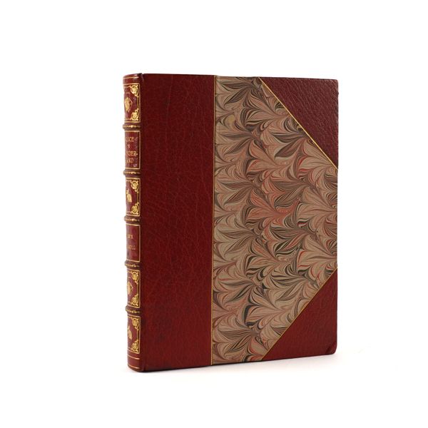 BINDING - "Lewis CARROLL" (1832-98). Alice in Wonderland, London, 1940, square 8vo, coloured plates after John Tenniel, FINELY BOUND in red half morocco gilt by Bayntun (Rivière), the spine gilt in compartments with white rabbit and playing card motifs.