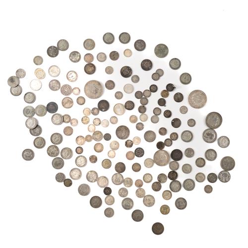A GROUP OF BRITISH AND FOREIGN MOSTLY SILVER COINS