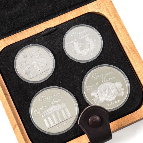 A SET OF FOUR CANADIAN SILVER PROOF COINS