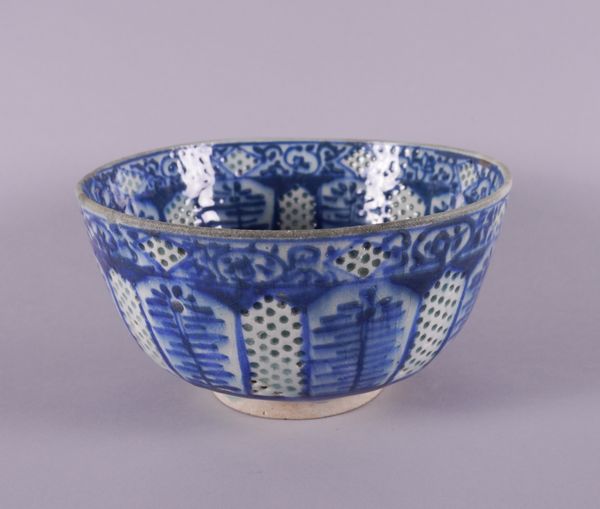 A PERSIAN BLUE AND WHITE POTTERY BOWL