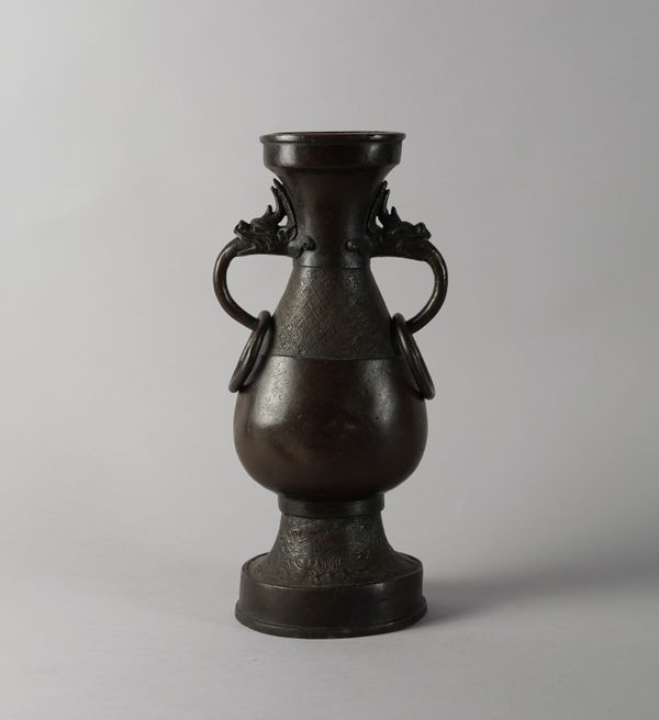 A TALL CHINESE BRONZE DRAGON-HANDLED VASE, HU