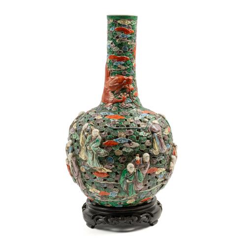 A CHINESE PIERCED AND RELIEF MOULDED BOTTLE VASE (2)