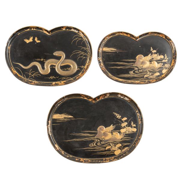 THREE GRADUATED JAPANESE BLACK AND GOLD LACQUER TRAYS (3)