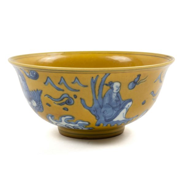 A CHINESE YELLOW-GROUND BLUE AND WHITE BOWL