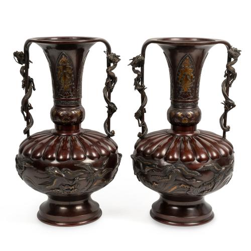 A LARGE PAIR OF JAPANESE BRONZE AND PARCEL-GILT TWO HANDLED VASES (2)