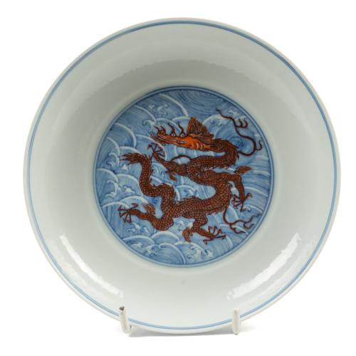 A CHINESE BLUE AND WHITE AND IRON-RED DRAGON DISH