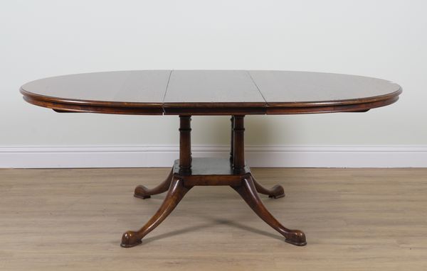 POSSIBLY TITCHMARSH AND GOODWIN; AN OVAL OAK EXTENDING DINING TABLE