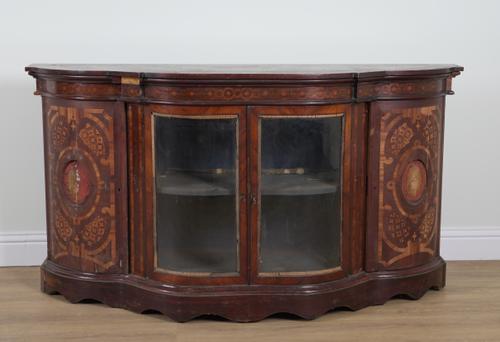 A 19TH CENTURY FRENCH GILT METAL MOUNTED KINGWOOD INLAID SERPENTINE CREDENZA