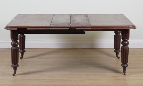 A GEORGE IV MAHOGANY EXTENDING DINING TABLE