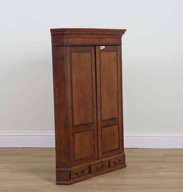 AN 18TH CENTURY OAK HANGING CORNER CUPBOARD