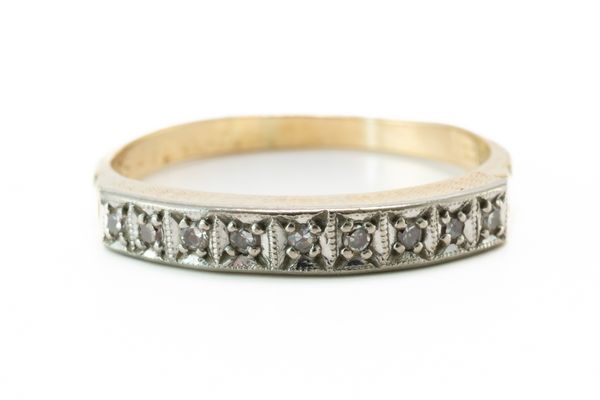 A GOLD AND DIAMOND HALF ETERNITY RING