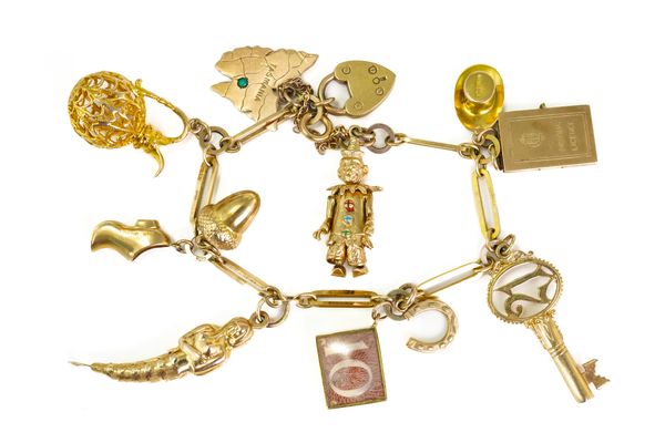 A GOLD CHARM BRACELET HAVING ELEVEN MOSTLY 9CT GOLD CHARMS