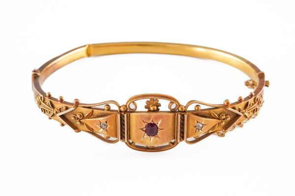 A 15CT GOLD, RUBY AND DIAMOND BANGLE