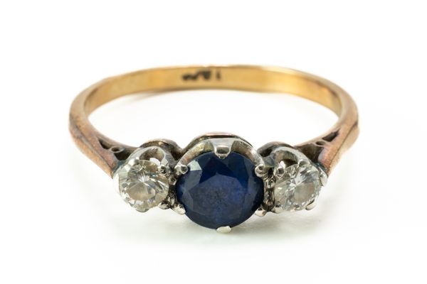 A SAPPHIRE AND DIAMOND THREE STONE RING