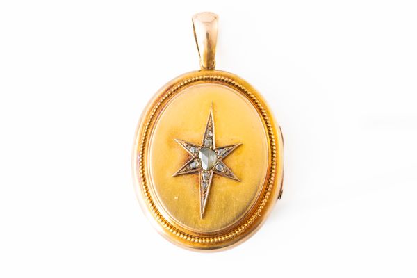 A VICTORIAN GOLD AND DIAMOND OVAL PENDANT LOCKET