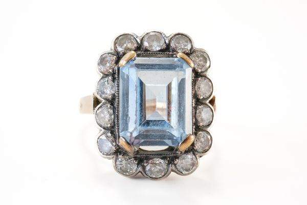 A SYNTHETIC BLUE SPINEL AND DIAMOND CLUSTER RING