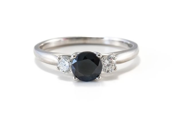 A THREE STONE SAPPHIRE AND DIAMOND RING