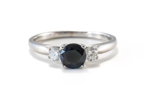 A THREE STONE SAPPHIRE AND DIAMOND RING