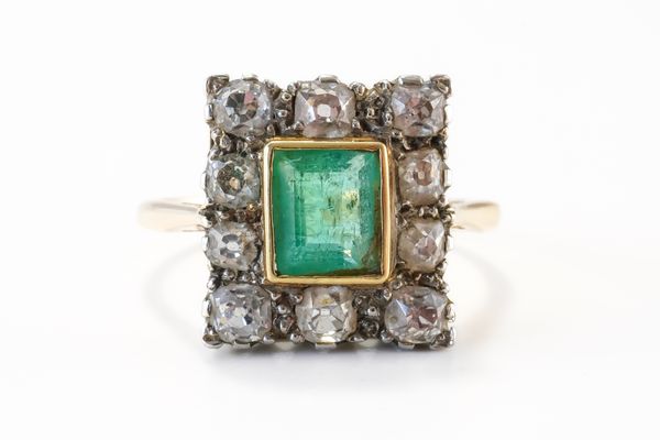 A GOLD, EMERALD AND DIAMOND CLUSTER RING