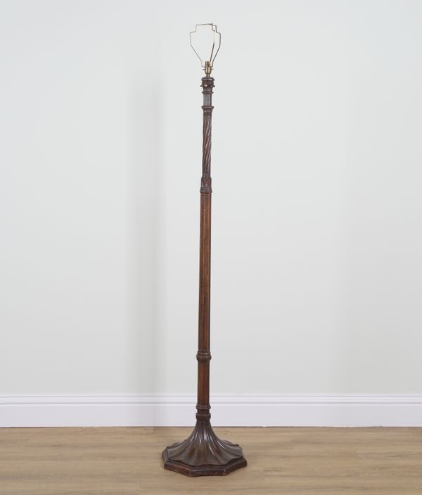 AN EARLY 20TH CENTURY CARVED OAK STANDARD LAMP