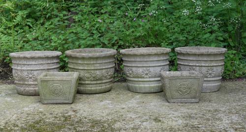 A SET OF FOUR RECONSTITUTED STONE CIRCULAR PLANTERS (6)