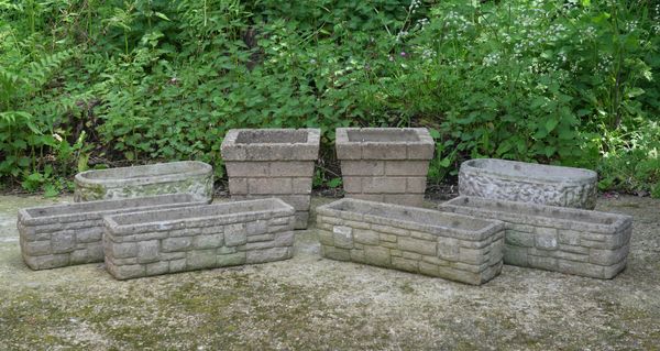 A SET OF FOUR RECONSTITUTED STONE RECTANGULAR PLANTERS (8)