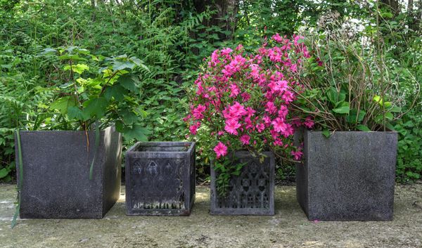 A PAIR OF GOTHIC STYLE RESIN SQUARE PLANTERS (4)