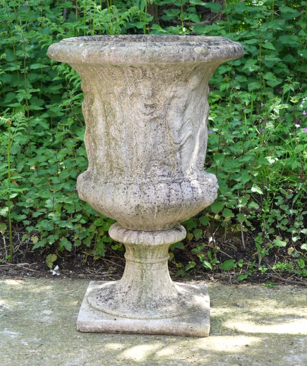 A RECONSTITUTED STONE GARDEN URN