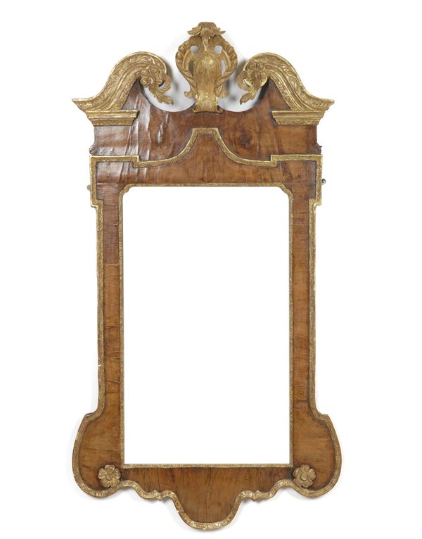 A GEORGE I STYLE WALNUT PARCEL GILT DECORATED PIER MIRROR