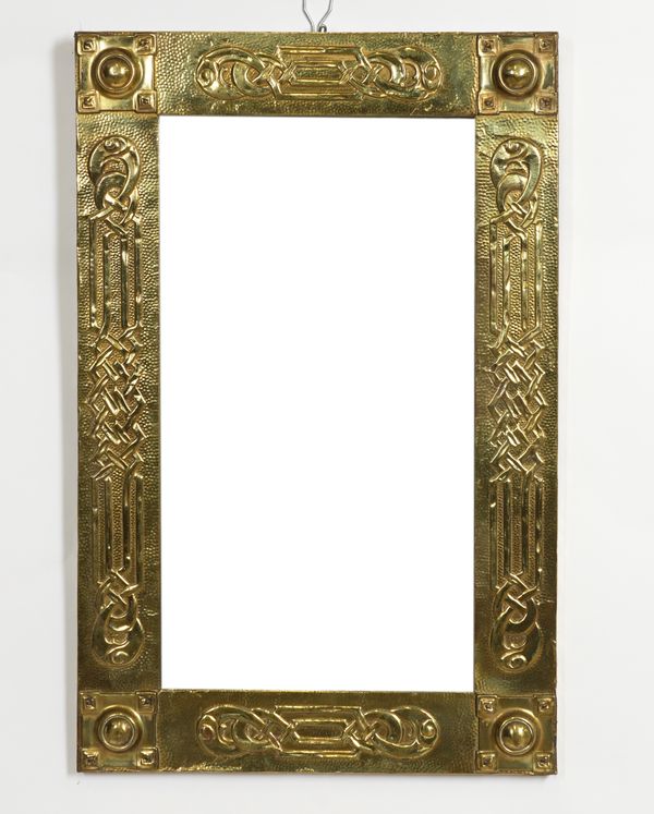 AN ARTS & CRAFTS BRASS REPOUSSE RECTANGULAR MIRROR