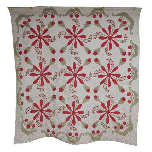 TWO POSSIBLY AMERICAN QUILTS WITH STYLISED RED FLORAL AND GREEN LEAF DESIGN (2)