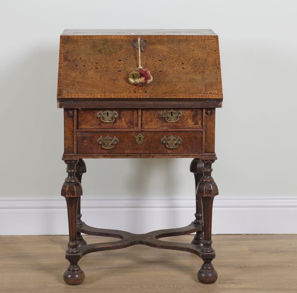 A WILLIAM AND MARY STYLE WALNUT SEAWEED MARQUETRY INLAID BUREAU ON STAND