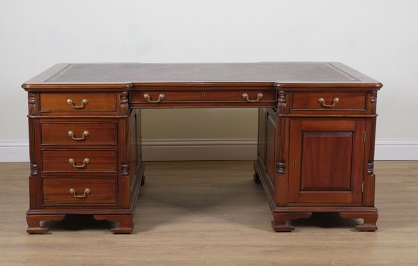 A MAHOGANY PARTNER'S NINE DRAWER PEDESTAL DESK