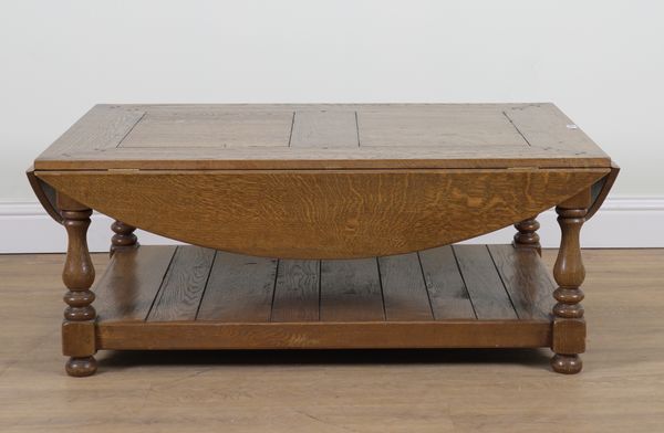 AN OAK DROP FLAP OVAL COFFEE TABLE