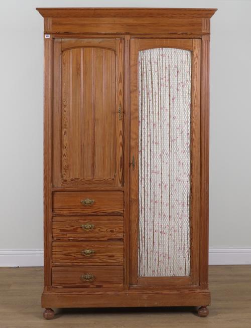AN EARLY 20TH CENTURY PITCH PINE WARDROBE