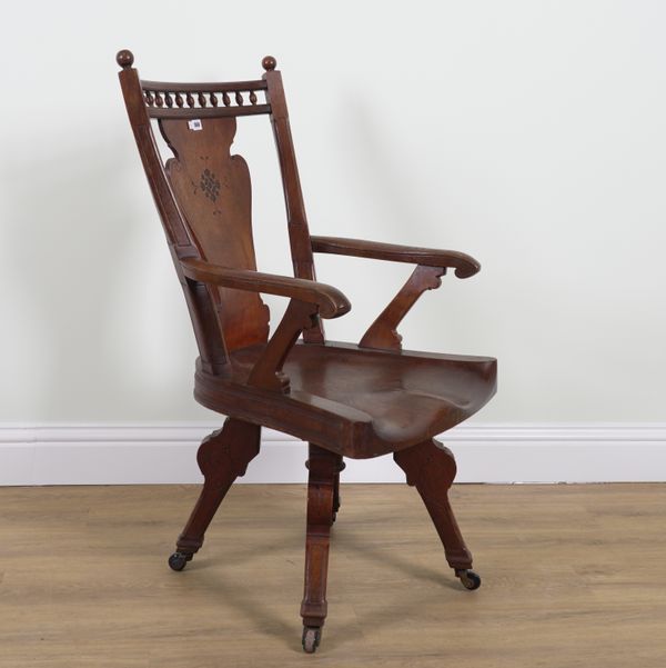 A LATE 19TH CENTURY AMERICAN OAK AND ELM SEATED REVOLVING DESK CHAIR (2)