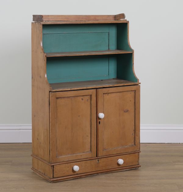 A REGENCY PINE WATERFALL BOOKCASE CUPBOARD