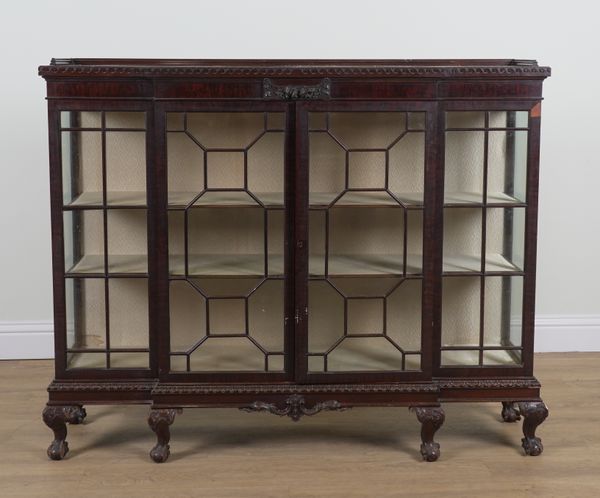 A LATE VICTORIAN MAHOGANY ASTRAGAL GLAZED BREAKFRONT BOOKCASE