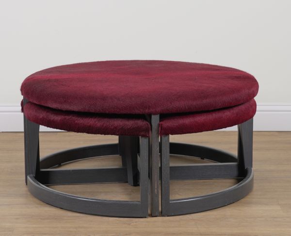 A RED FAUX HIDE UPHOLSTERED CIRCULAR FOOTSTOOL (5)