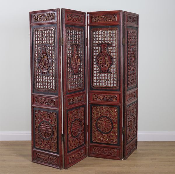 A LATE 19TH CENTURY CHINESE EXPORT PARCEL GILT RED LACQUER FOUR FOLD SCREEN