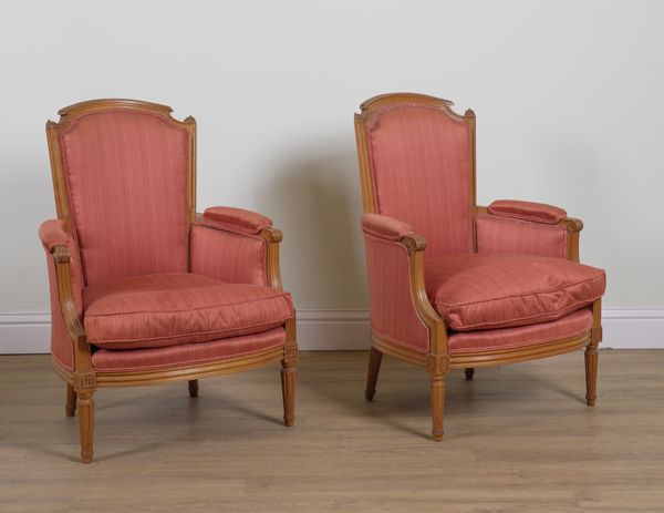 A PAIR OF LOUIS XVI STYLE WALNUT FRAMED ARMCHAIRS (2)